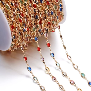 Macro shot of colorful gemstone chain with golden setting for DIY jewelry making