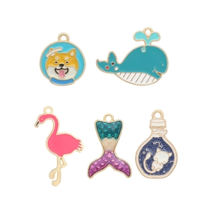 Colorful enamel animal charms collection including space shiba, whale, and flamingo pendants