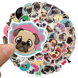 Pack of 50 cute Pug dog stickers for laptops and phones shown in hand for size