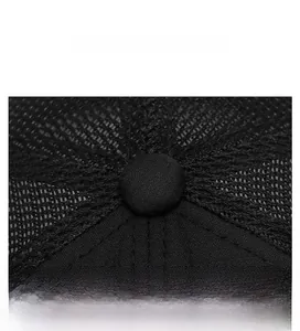 Close-up of black breathable mesh fabric and reinforced stitching on top of a sun hat