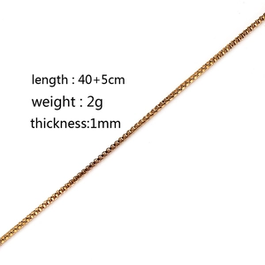 Golden box chain necklace showing 1mm thickness and 40+5cm length on white background