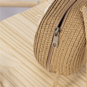 Handcrafted straw shoulder bag for girls with zipper closure and woven strap detailing