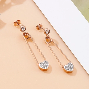 Détails de boucles d'oreilles épingle à nourrice or rose avec pendentifs cœur en zircon