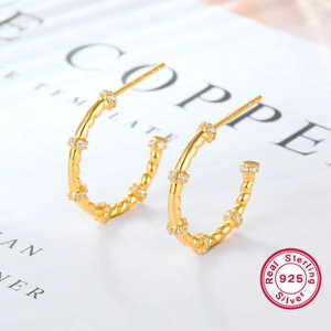 925 sterling silver gold plated twist hoop earrings with white zircon accents