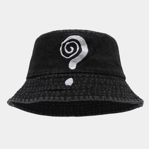 Detail of white question mark embroidery on washed black cotton bucket hat