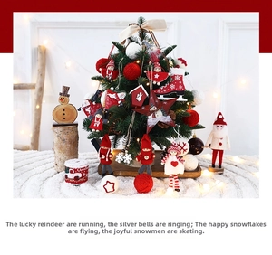 Cozy holiday scene with red and white knit ornaments on a small festive Christmas tree