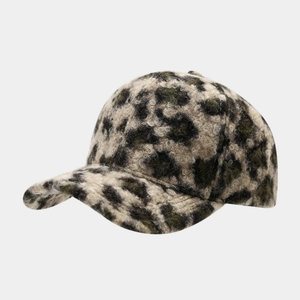 Close-up of leopard print faux fur texture on a vintage style warm baseball cap
