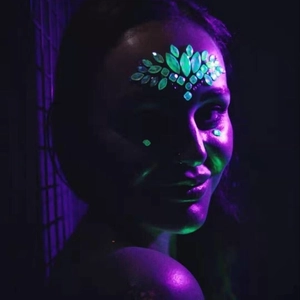 Luminous forehead face jewels with glowing green rhinestone gems for music festivals