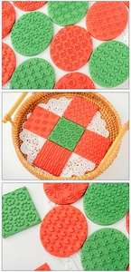 Detail of red and green Christmas cookie stamps featuring reindeer and snowflake patterns