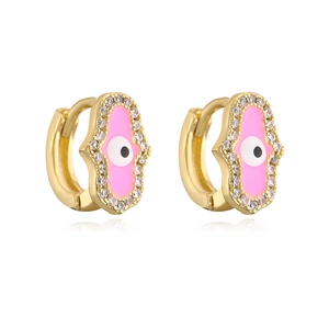 Detail of Hamsa hand earrings in 18K gold plating with pink enamel and clear zircons