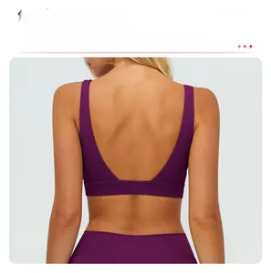 Detail view of deep purple yoga bra with elegant V-shaped open back and matte fabric