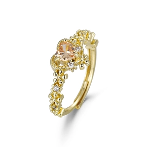 Exquisite gold open ring featuring a heart-shaped citrine and floral band design