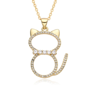 Close-up of a cat-shaped golden necklace pendant with inlaid sparkling white crystals