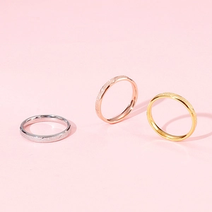 Minimalist frosted stainless steel rings set in silver, gold and rose gold finishes