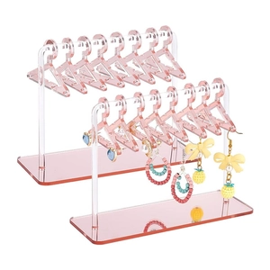 Pink acrylic earring organizer with mini coat hangers for jewelry display and storage