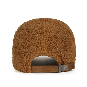 Rear view of brown lambswool baseball cap featuring adjustable suede strap and metal buckle