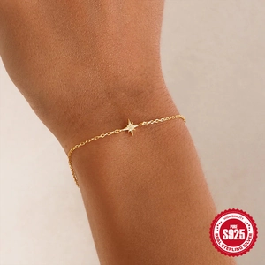 925 sterling silver gold bracelet featuring a sparkling octagonal star charm on wrist
