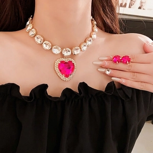 Statement jewelry set with round white zircons and large fuchsia heart crystal pendant