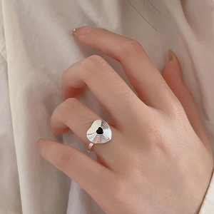 Minimalist 925 sterling silver heart ring with textured wavy surface and black enamel inlay