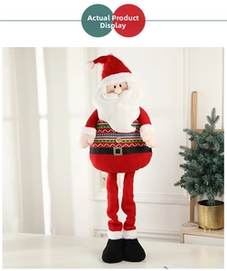 Detail view of a tall Santa Claus doll with red knitted hat and decorative fabric boots