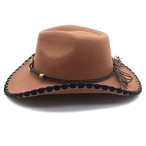 Detail of wool felt cowboy hat featuring brown braided rope and horse pendant