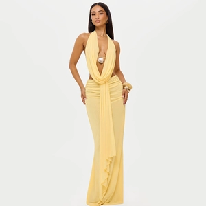 Detail of yellow V-neck halter dress with metal ring and elegant waist draping