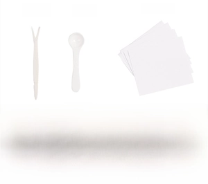 Detail of vampire teeth adhesive kit including powder liquid spatula and application guide