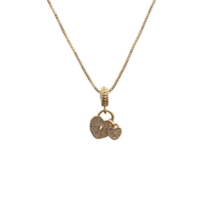 Detail of gold box chain necklace featuring a dual heart pendant with crystal pavé and keyhole