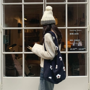 Navy plush knit tote bag with 3D white flower pattern and matching winter knit hat