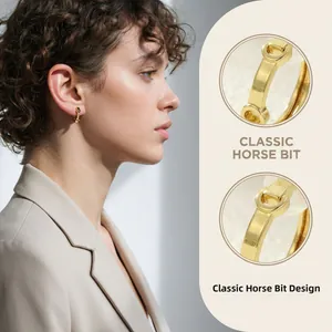Detail showing 18K gold plated horsebit earrings with micro-inlaid zircon accents