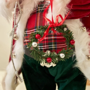 Classic red and green Christmas wreath ornament featuring festive berries and ribbon ties