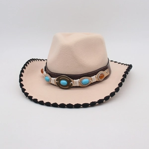 Detailed view of western felt hat with turquoise stone leather band and braided brim edge