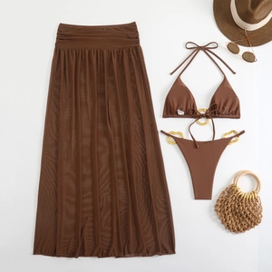 Flat lay of a coffee brown three-piece bikini set with sheer mesh skirt and gold rings