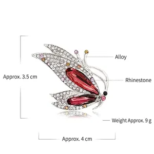 Detail view of butterfly brooch with pink rhinestones, sizing 4cm and 9g weight