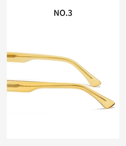 Detail of transparent yellow eyewear arms with decorative diamond-pattern metal core wire