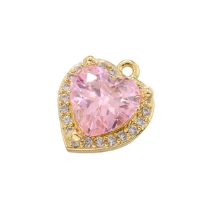 Close-up of heart-shaped pink zircon pendant with gold-plated setting and tiny diamonds