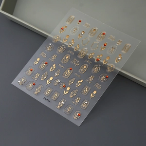 Macro shot of 3D tulip nail stickers with gold relief and sparkling rhinestone details