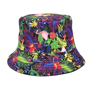 Close-up of tropical flamingo and palm leaf print detail on a reversible bucket hat