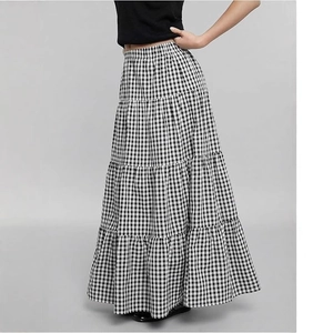 Detail of tiered black and white gingham maxi skirt with classic plaid pattern