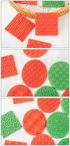 Macro detail of red and green Christmas cookie stamps with reindeer and tree patterns