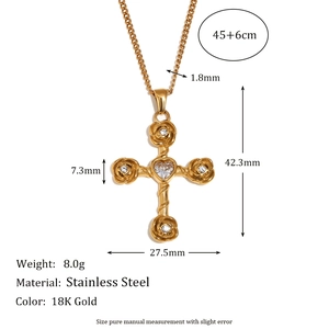18K gold stainless steel cross necklace with rose detail and clear stones on white background