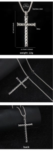 Macro detail of silver cross pendant with snake scale texture and size measurements