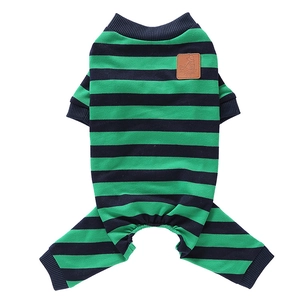 Detail of green and black striped dog pajamas with brown leather puppy patch decoration