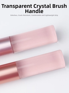 Detail of transparent pink gradient makeup brush handles with crystal-like texture