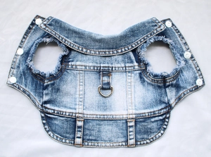 Detailed view of denim pet vest with reinforced metal D-ring for leash attachment