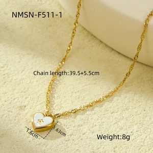Macro shot of gold heart pendant with star detail and full technical specifications
