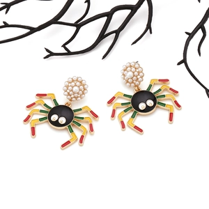 Colorful striped spider earrings with pearl accents and dark Halloween insect design