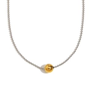 Minimalist stainless steel ball chain necklace with gold bead pendant on white background
