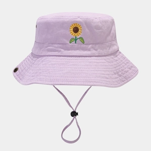 Close-up of lavender cotton bucket hat with sunflower embroidery and adjustable chin strap