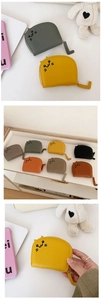Close-up of cute cat-shaped coin purses with embroidery and tail-shaped zippers